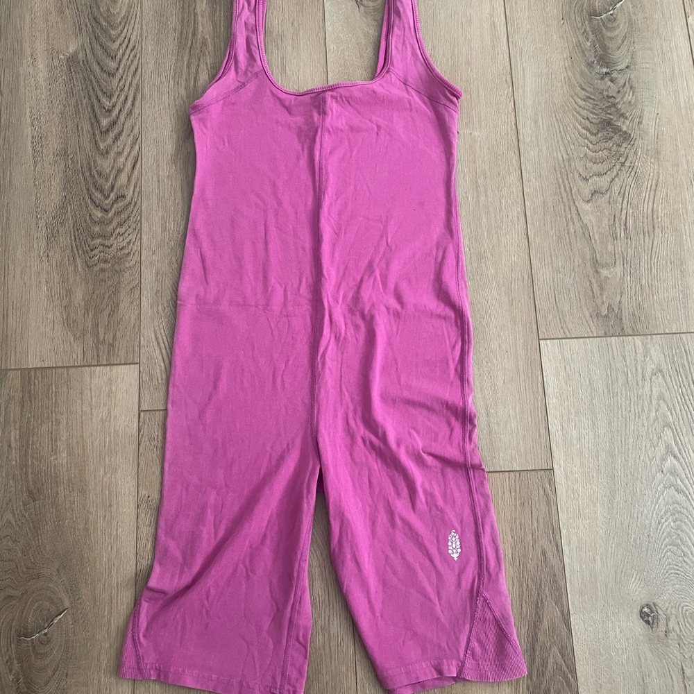 Free people got shot onsie in pink. SOLD OUT ONLINE. Excellent condition.